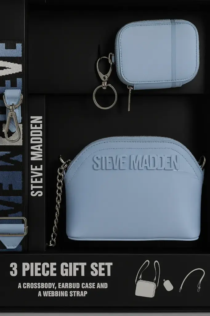 Steve Madden Light blue crossbody bag with matching earbud case and a logo webbing strap.