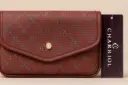 Charriol burgundy crossbody luxury  bag with CC monogram pattern 